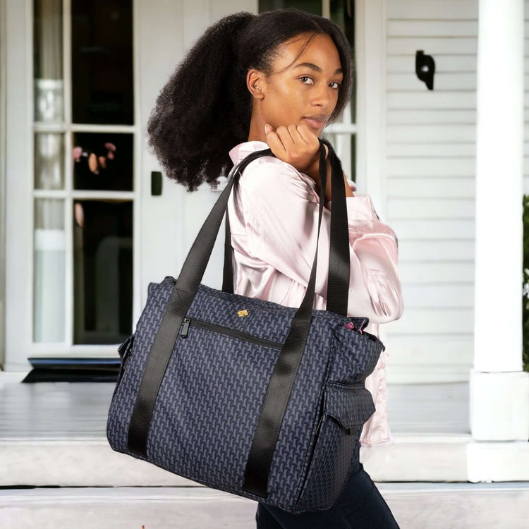 mom leaving the house with her breast pump bag tote spectra