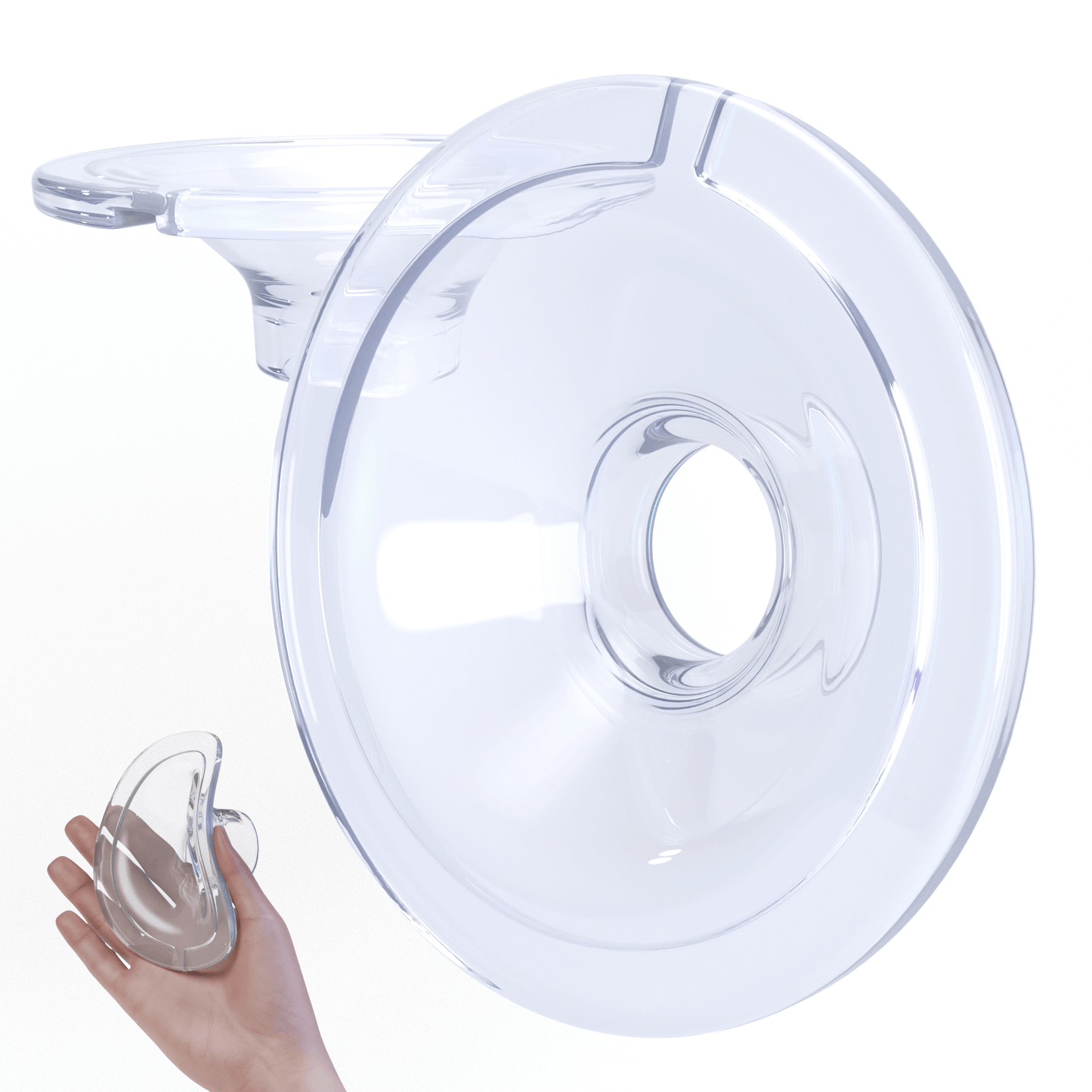 Wearable breast pump flange made of clear, soft silicone, shown with hand for size reference.