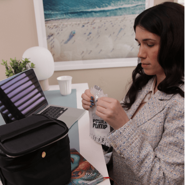 mom sealing the idaho jones breast milk storage bag filled with pumped milk