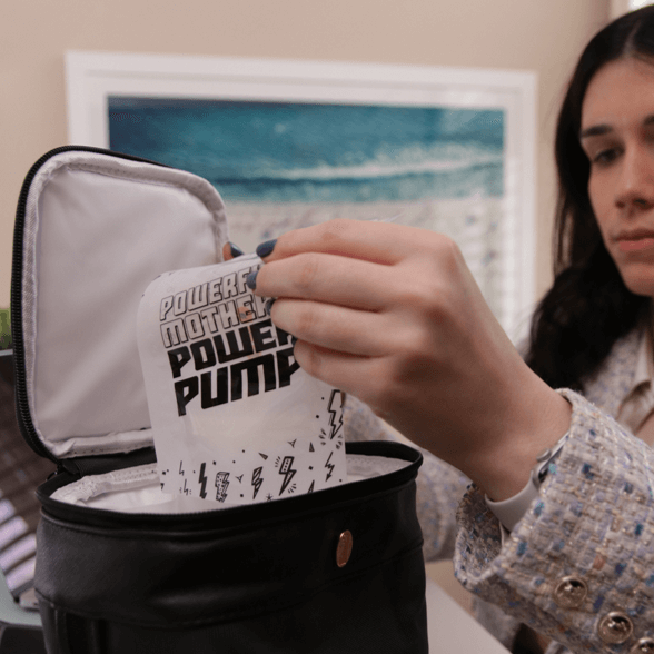 mom placing the idaho jones breastmilk bag filled with pumped milk to roxwell cooler bag