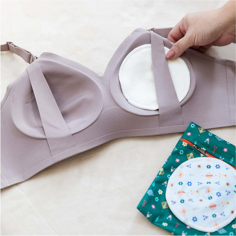 Image of reusable organic bamboo type nursing pads with a broad coverage area that is contoured for attachment to nursing bras