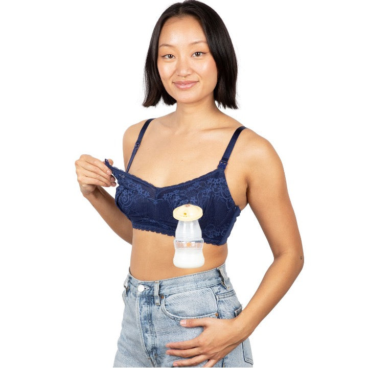 mom wearing the medieval blue aine pumping bra with pump bottle filled with milk on one side and unclasped clip on the other