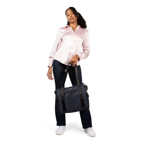 Image of Mom confidently carrying only one bag for all of her stuff and feeling at peace on the go